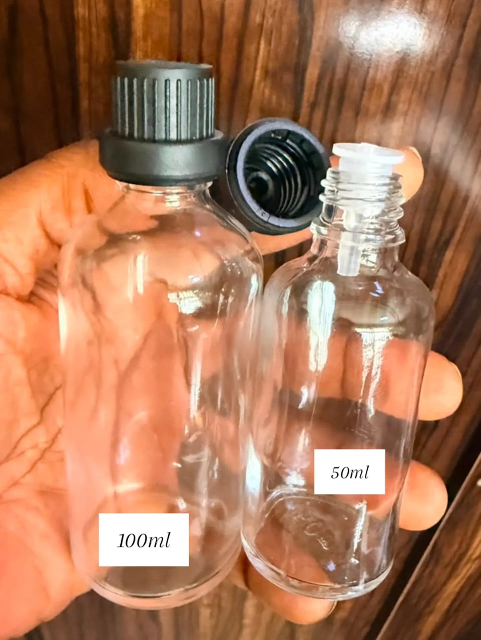 100ml Transparent glass bottle with black caps