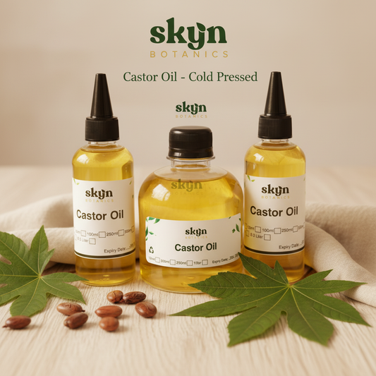 SKYNBotanics Premium Cold-Pressed Castor Oil bottles with botanical logo, product name and subtle watermark