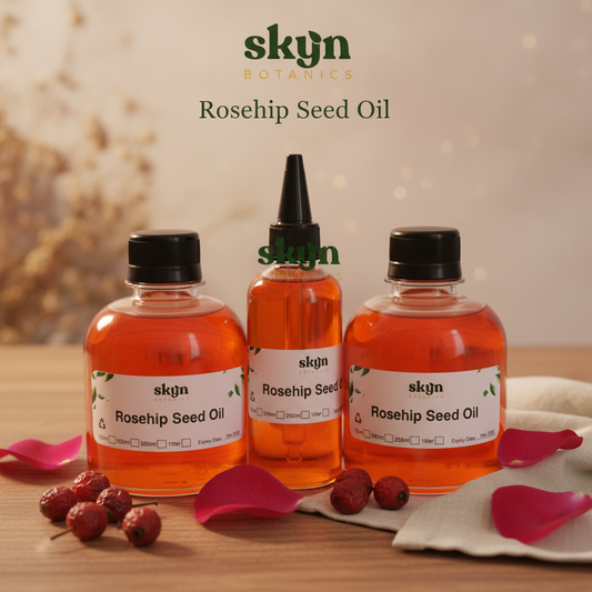 SKYNBotanics Premium Rosehip Seed Oil bottles with vibrant orange-red color, botanical logo, product name and subtle watermark